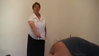 Aged Female Punishes Male With Cane