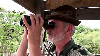 A Mature Man Engages In Sexual Activity With A Young Woman During A Hunting Expedition.